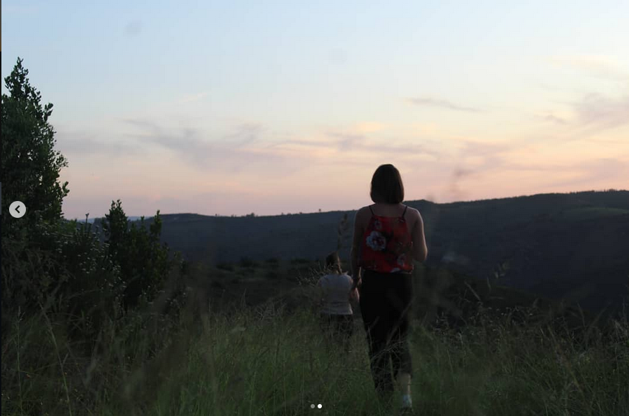 Walking through fields at dusk