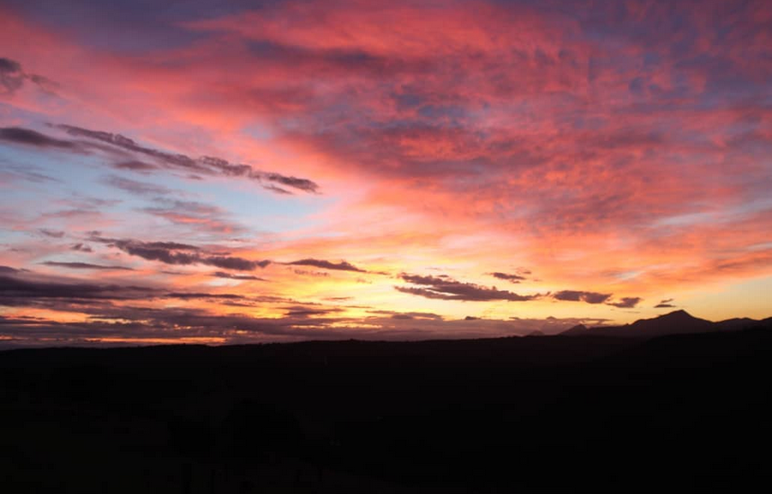 Vibrant pink and orange sunset sky